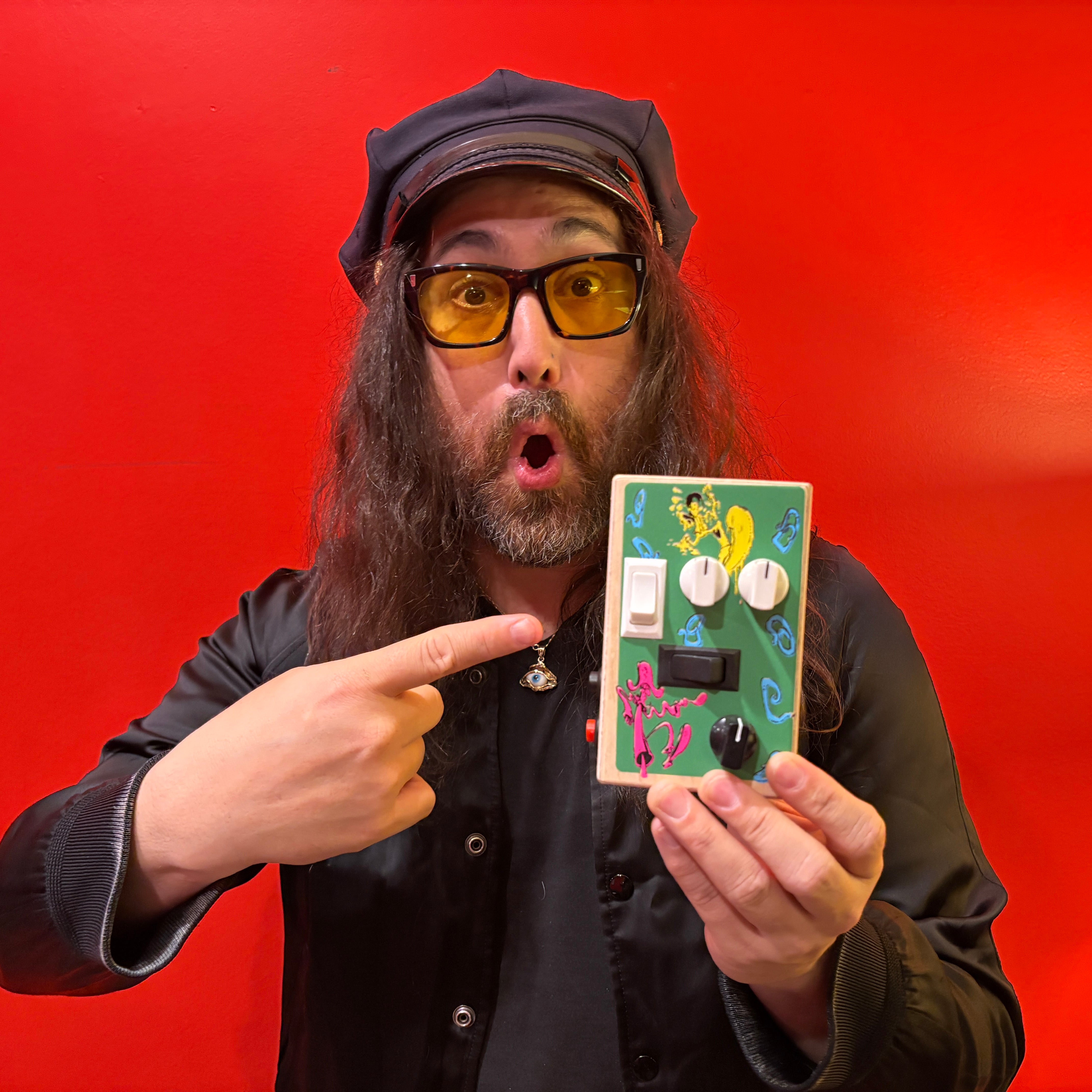 Sean Lennon displaying the limited edition BrandNewNoise collaborative audio gadget with the Claypool Lennon Delirium