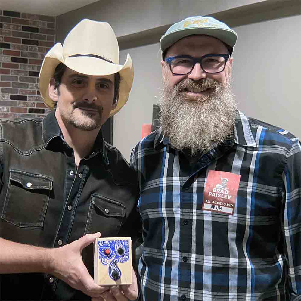 Brad Paisley and BrandNewNoise creator Richard Upchurch with hand signed custom musical toy